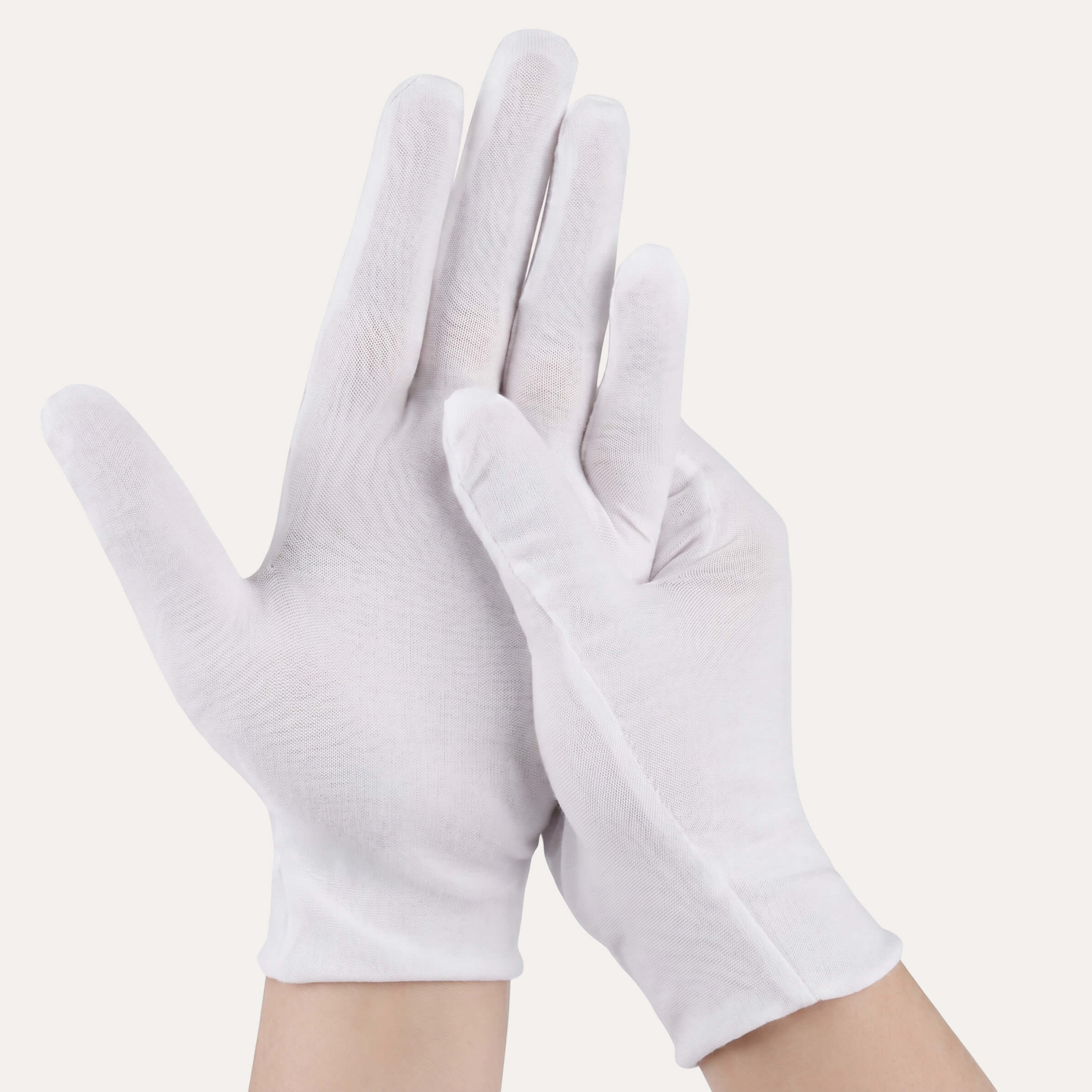 A pair of hands wear Sassy Saints' Overnight Moisturising Nail Gloves—one hand raised, the other gently touching the palm—against a plain, light background, showcasing salon-quality care at home.