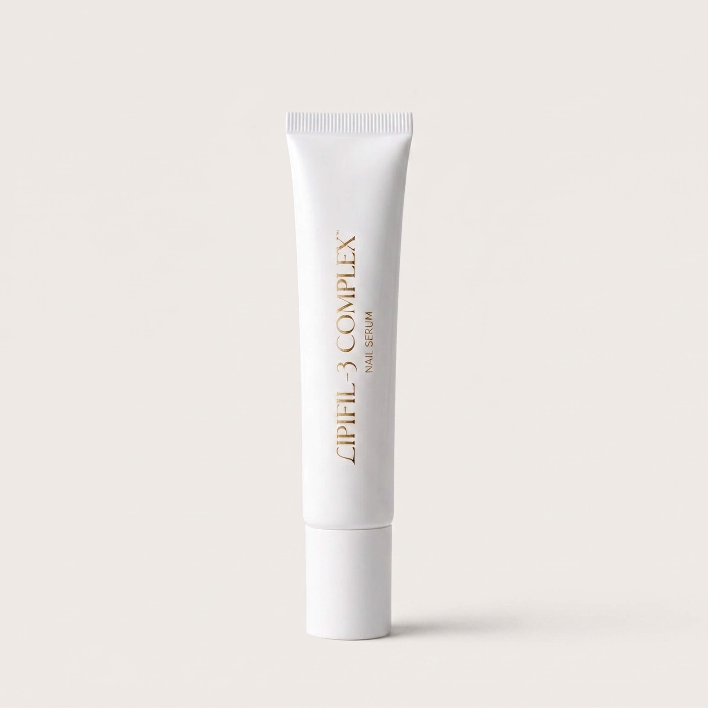 A white tube of Sassy Saints - Brings The Salon Home LIPIFIL-3 Complimenting Nail & Hand Cream stands upright on a light beige background, featuring gold text printed vertically on the front.