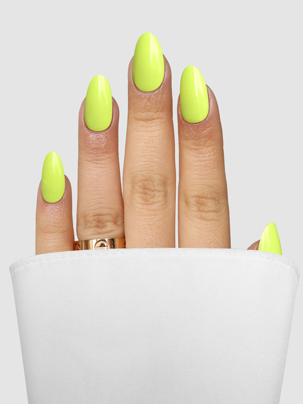 Hand with long, almond-shaped nails featuring Lime Light Gel Wrap in a bright neon lime color.