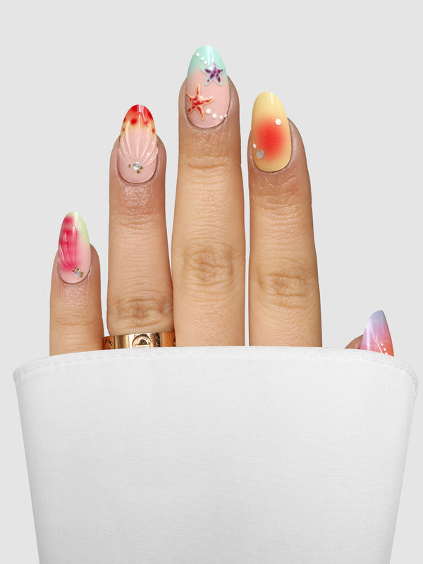 Mermaid Mood (3D) Gel Wrap fingernails decorated with colorful beach-themed designs including a seashell, starfish, and airbrushed ombre patterns, accented with small rhinestones.