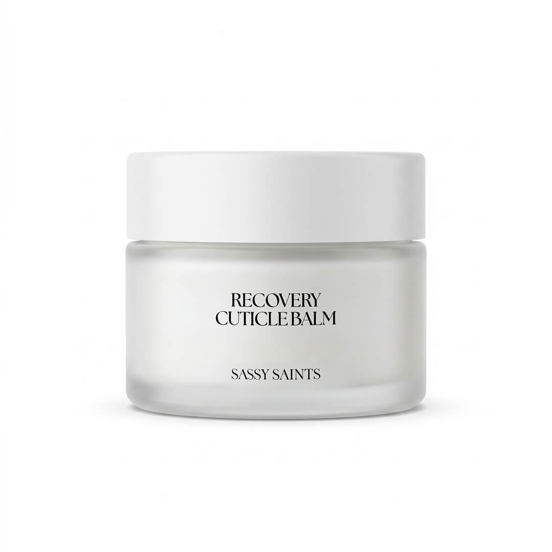 A clear glass jar with a white lid, labeled "Recovery Cuticle Balm" and "Sassy Saints - Brings The Salon Home" on the front, set against a plain white background.