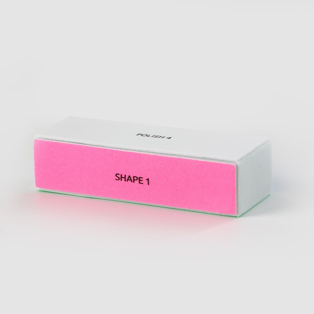 The Sassy Saints 4 Sided Nail Tool Buffer Block features a white top labeled POLISH 4 and a pink side labeled SHAPE 1, shown on a plain white background.