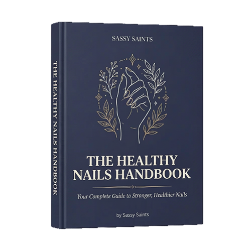 The Healthy Nail Ebook by Sassy Saints is a dark blue guide featuring a line drawing of a hand with outlined leaves and branches, and the subtitle "Your Complete Guide to Stronger, Healthier Nails.
